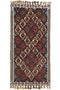 Decorative rug with geometric pattern and tassels