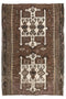 Brown and beige patterned rug with intricate designs 