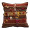 Decorative pillow with striped pattern and embroidered designs